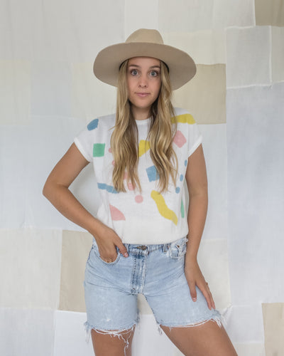 Vintage knit t-shirt featuring colourful shapes. Women's size small.